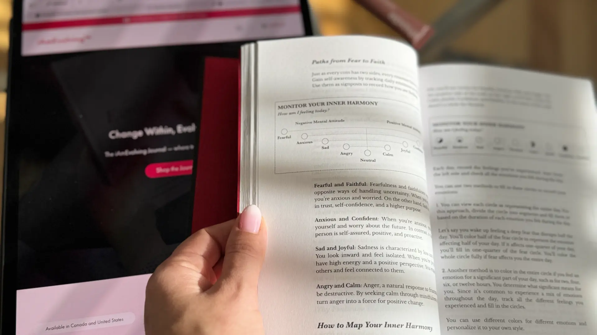 Person using the iAmEvolving Journal to monitor inner harmony and emotional balance, open to the section about mapping emotions.