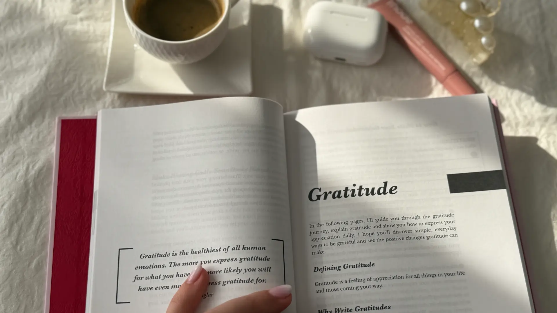 Open gratitude journal with coffee cup and morning light — mindfulness journaling practice