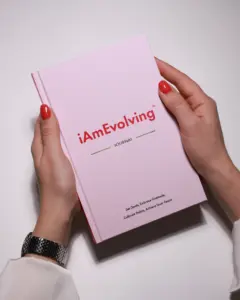 iAmEvolving Journal rose edition held on white background